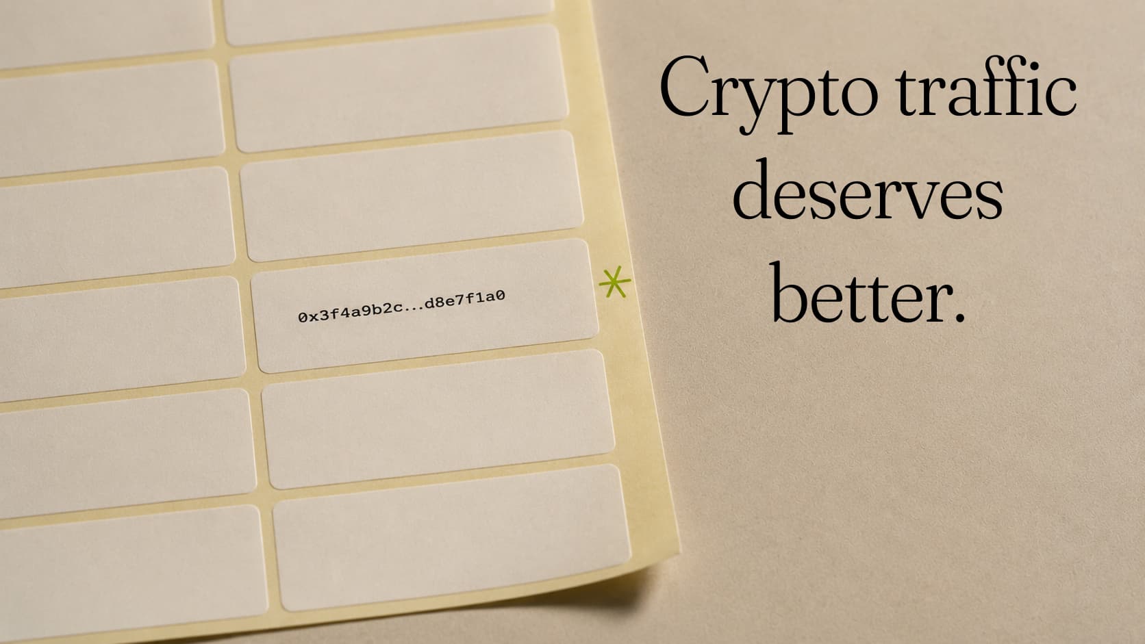 A sheet of blank adhesive labels with one printed 0x3f4a9b2c…d8e7f1a0 and starred in green. Set beside the words: Crypto traffic deserves better.